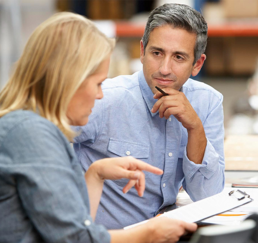 Man listening to coworker talk