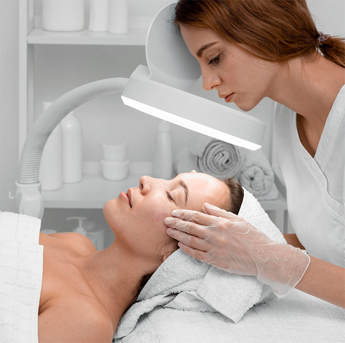 A woman getting a facial at a spa
