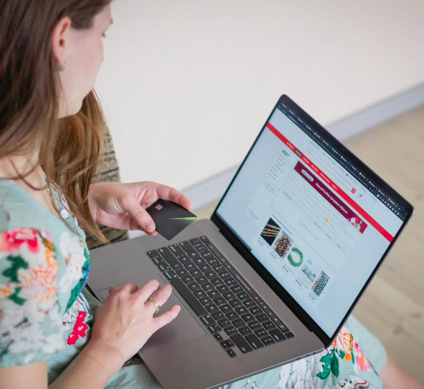 A woman online shopping on her computer